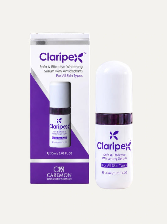 Claripex Safe & Effective Whitening Serum by Caremon, shown with its purple and white retail box and the white serum bottle with a dark purple collar on a light beige background.